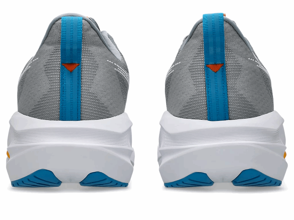 Gray knit men’s men's ASICS Novablast 5 running shoe, blue heel pull tab, white midsole, orange accents.