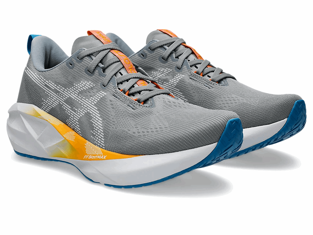 Gray knit men's ASICS Novablast 5 running shoe with orange lace accents, blue heel trim, thick white cushioned sole.