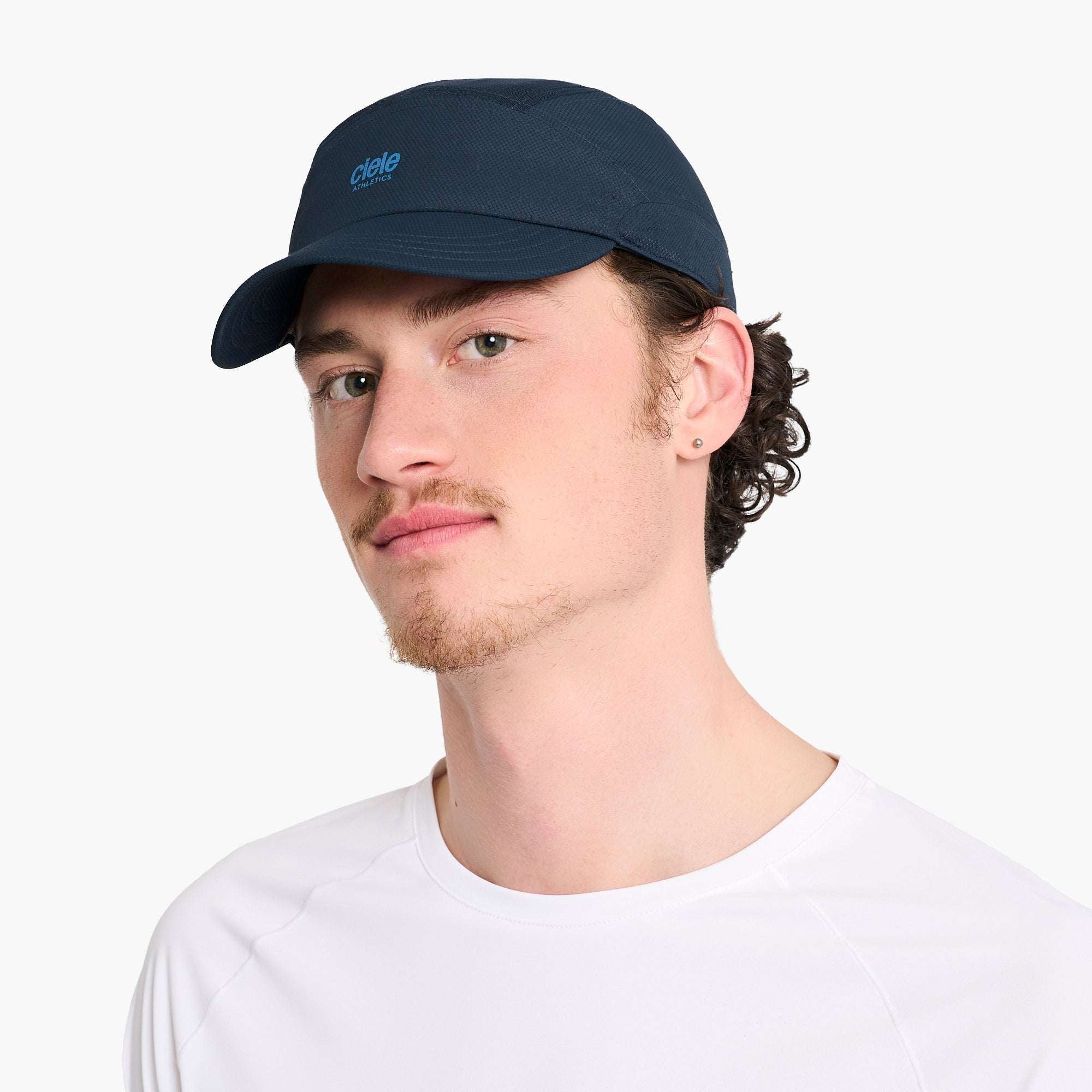 Ciele Dark navy Ciele running cap on model, side profile