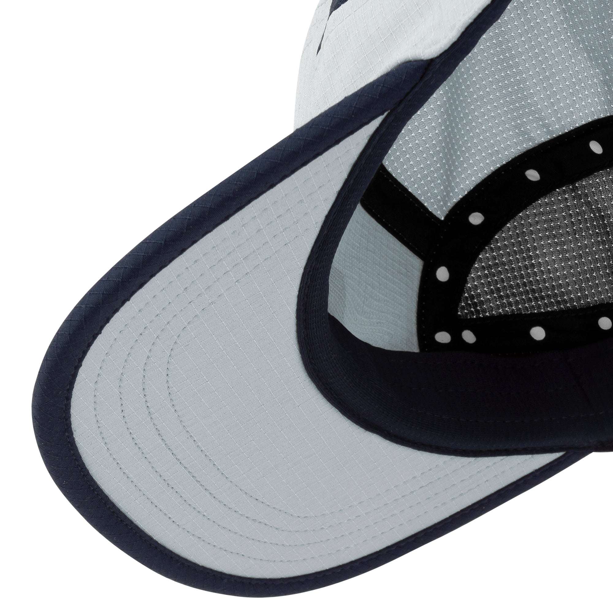 Ciele Athletics field cap close-up of navy brim and light gray textured fabric