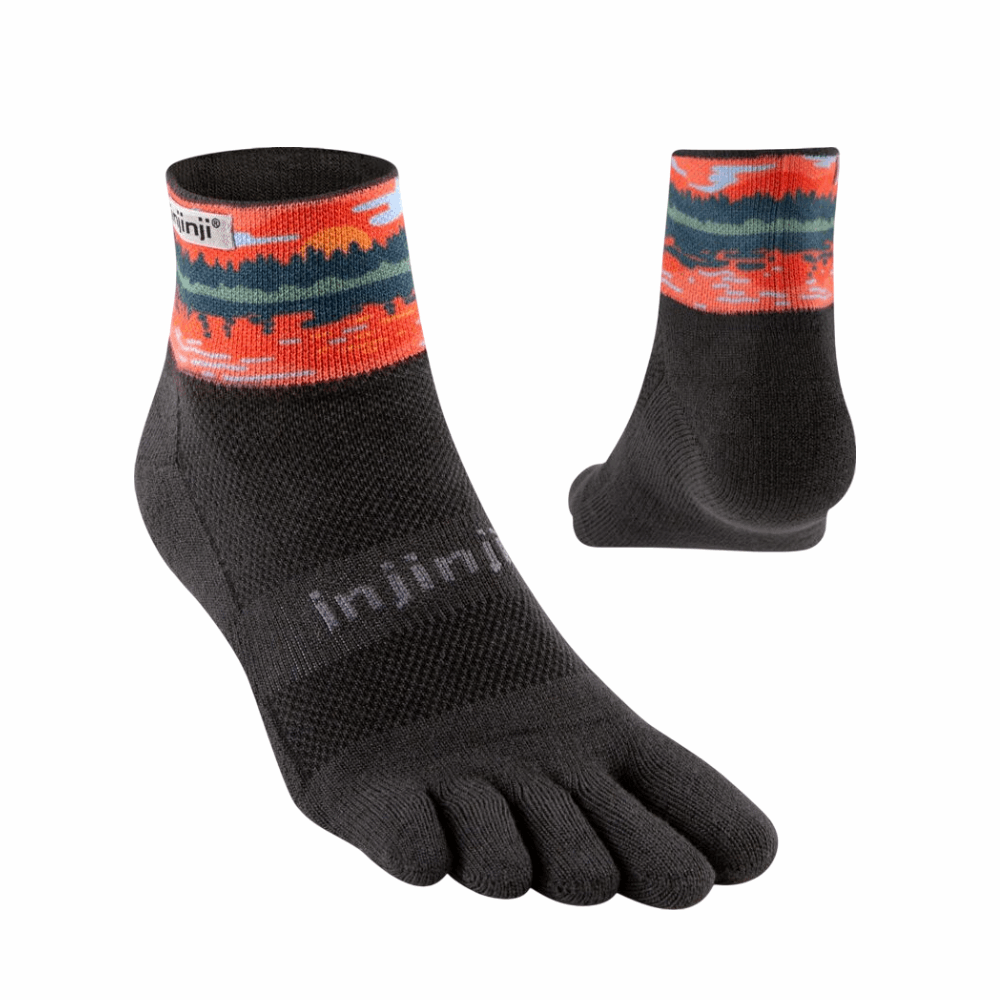 Pair of Injinji mini-crew socks, black with orange/teal patterned cuffs and five toes