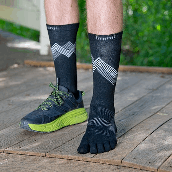 Black crew Injinji running socks with gray chevron pattern and five-toe design