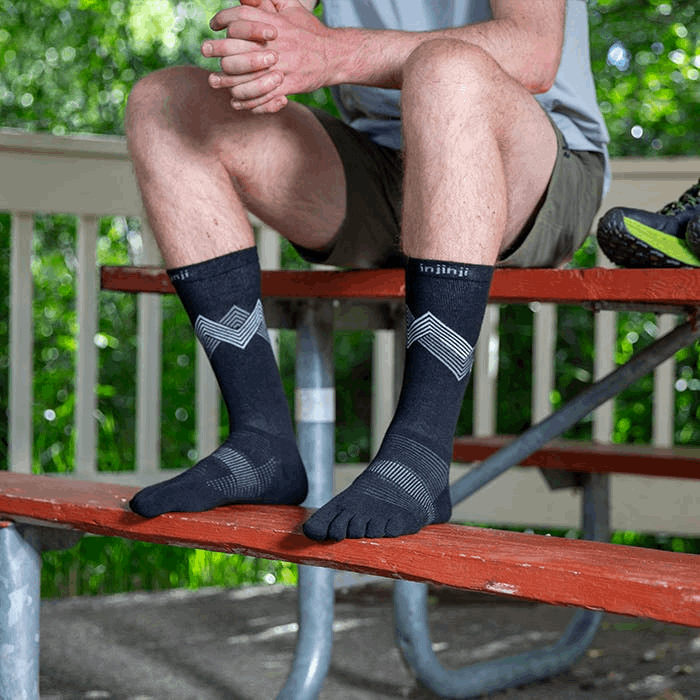 Black crew Injinji running socks with gray chevron pattern and five-toe design