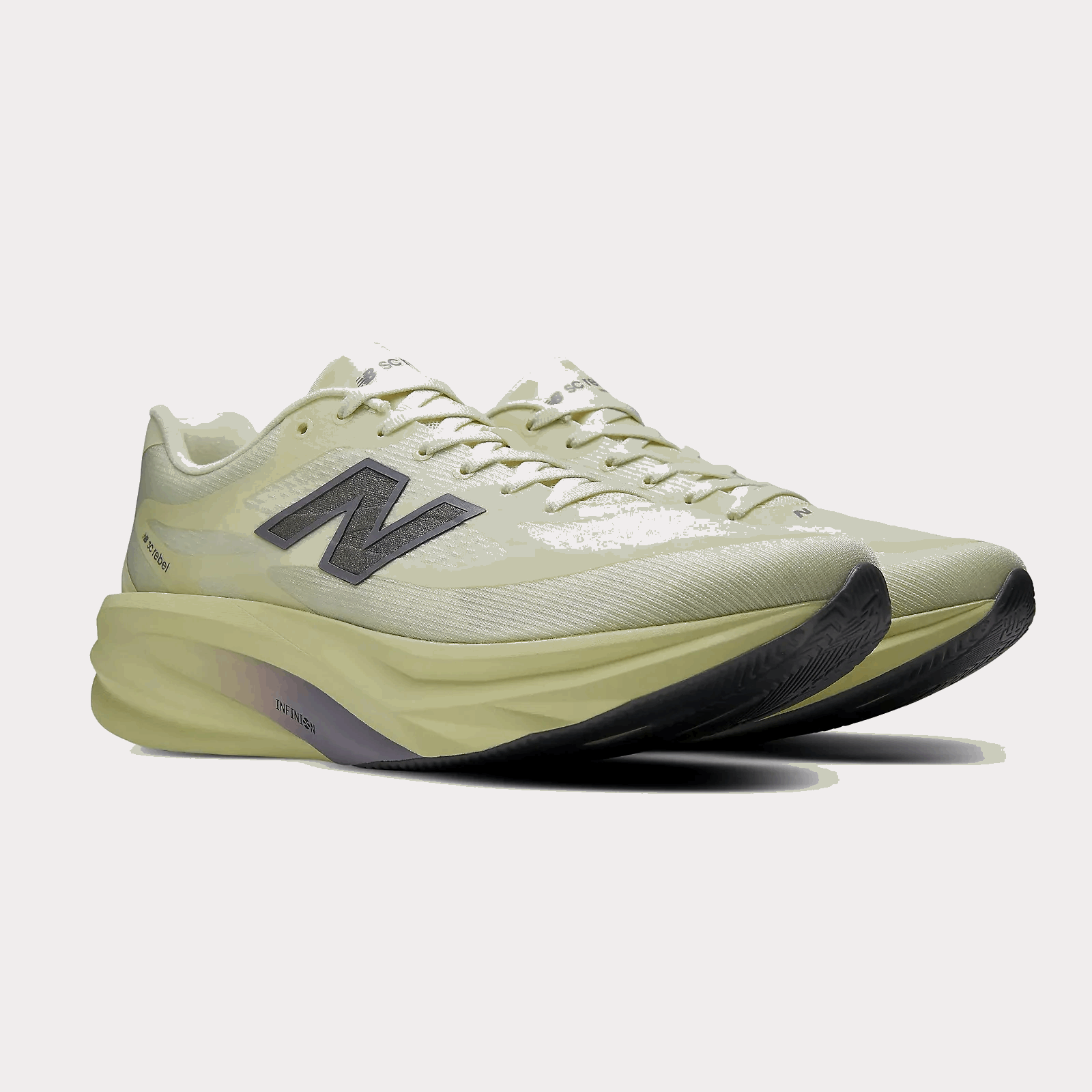 Men's lace-up New Balance SuperComp Rebel running shoe with light green knit upper, navy logo, and yellow midsole